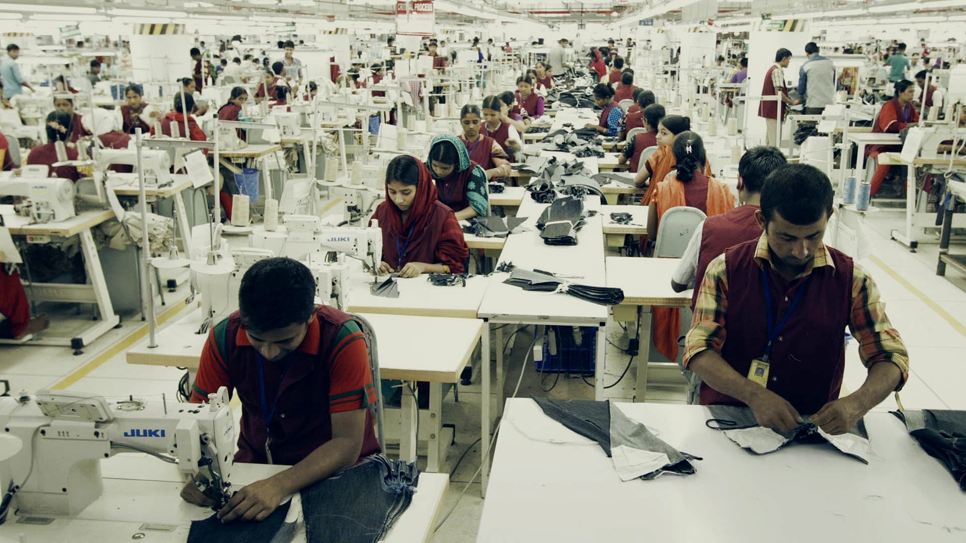 Operators on a woven-garment sewing line
