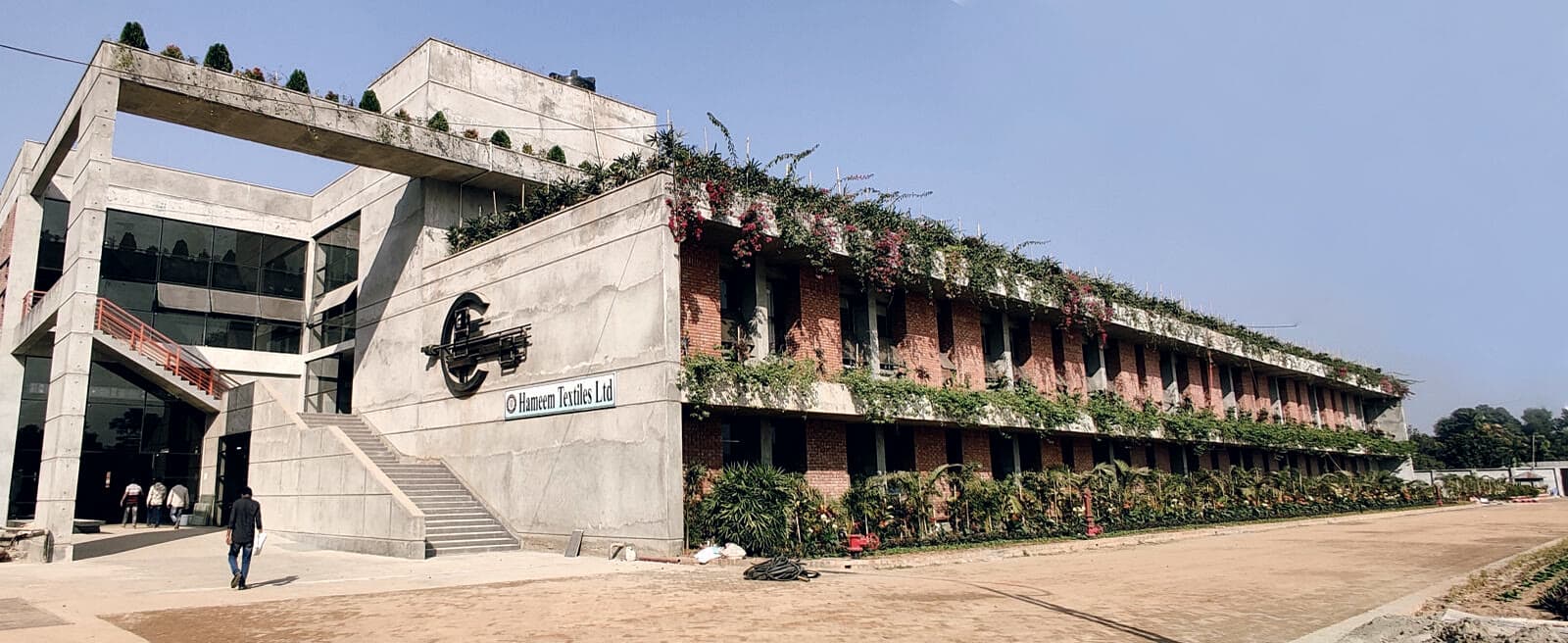 Ha-Meem Textiles at Mawna, its balconies planted with bougainvillea